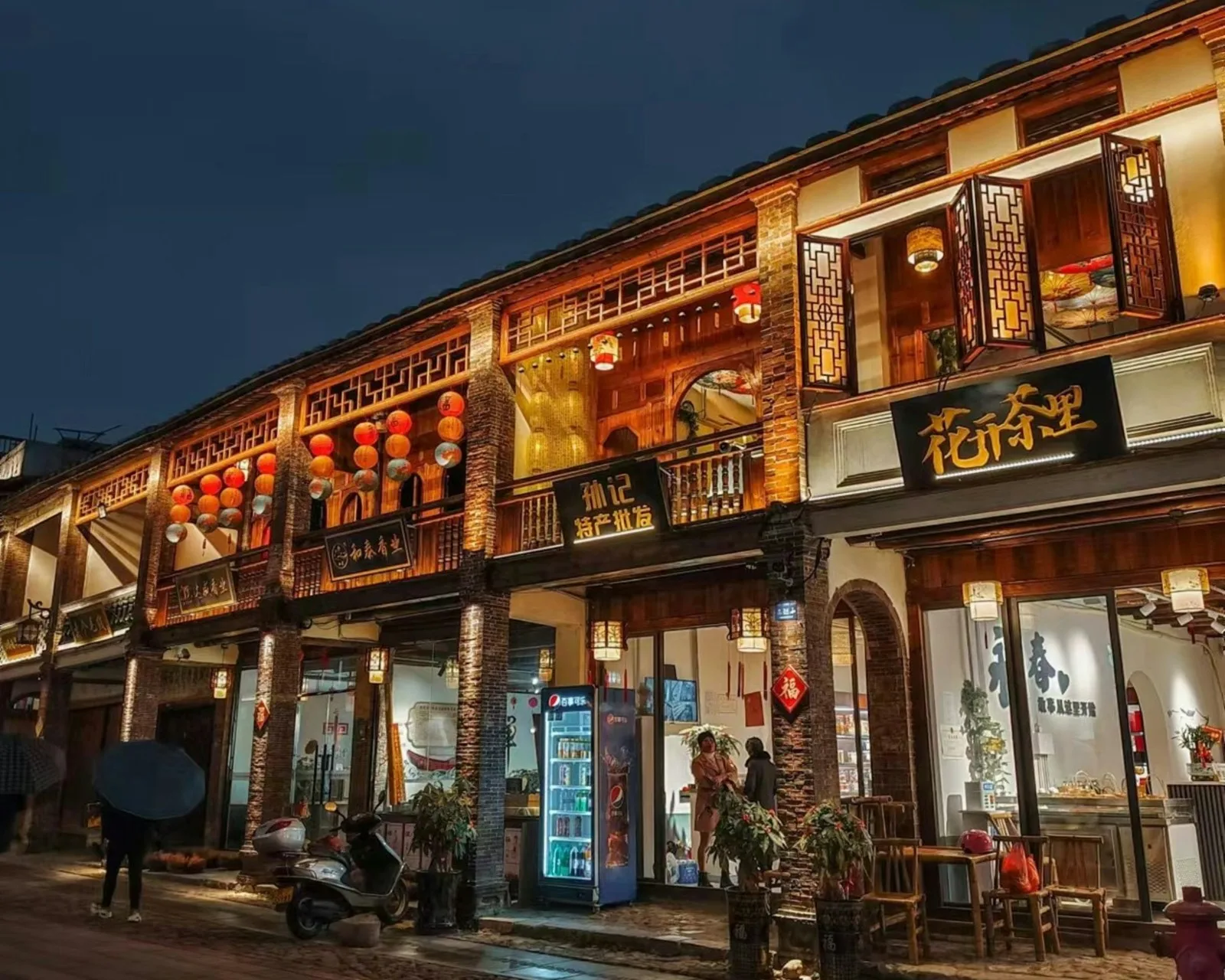Quanzhou old town courtyard with red brick walls and grey roof tiles in soft rain