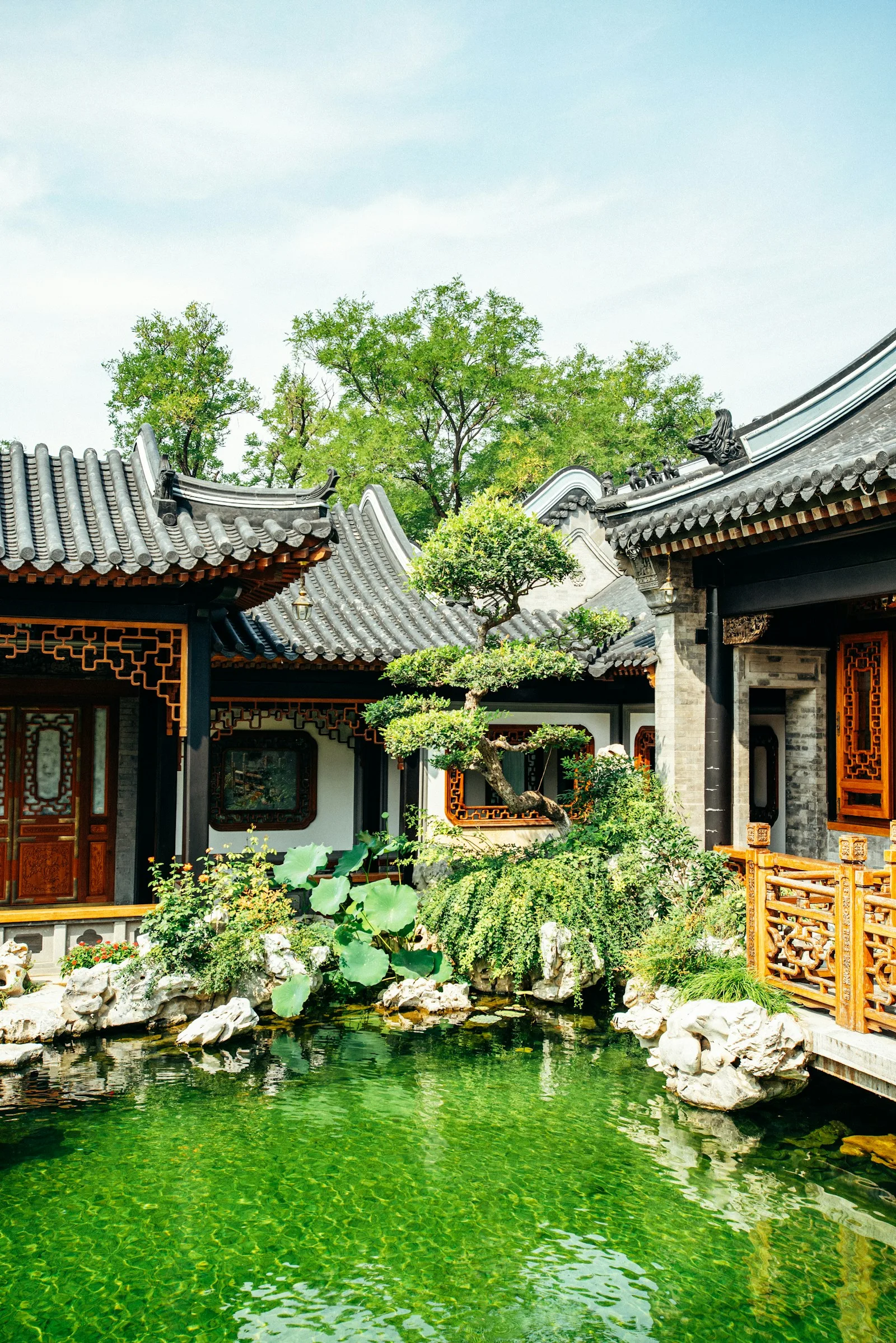 Lingnan courtyard interior with grey brick walls and tiled roof in Guangzhou.